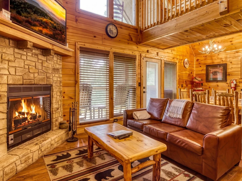 Bearadise Mountain Lodge living room with stone encased fireplace