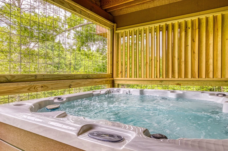 Bearadise Mountain Lodge hot tub on main level covered deck
