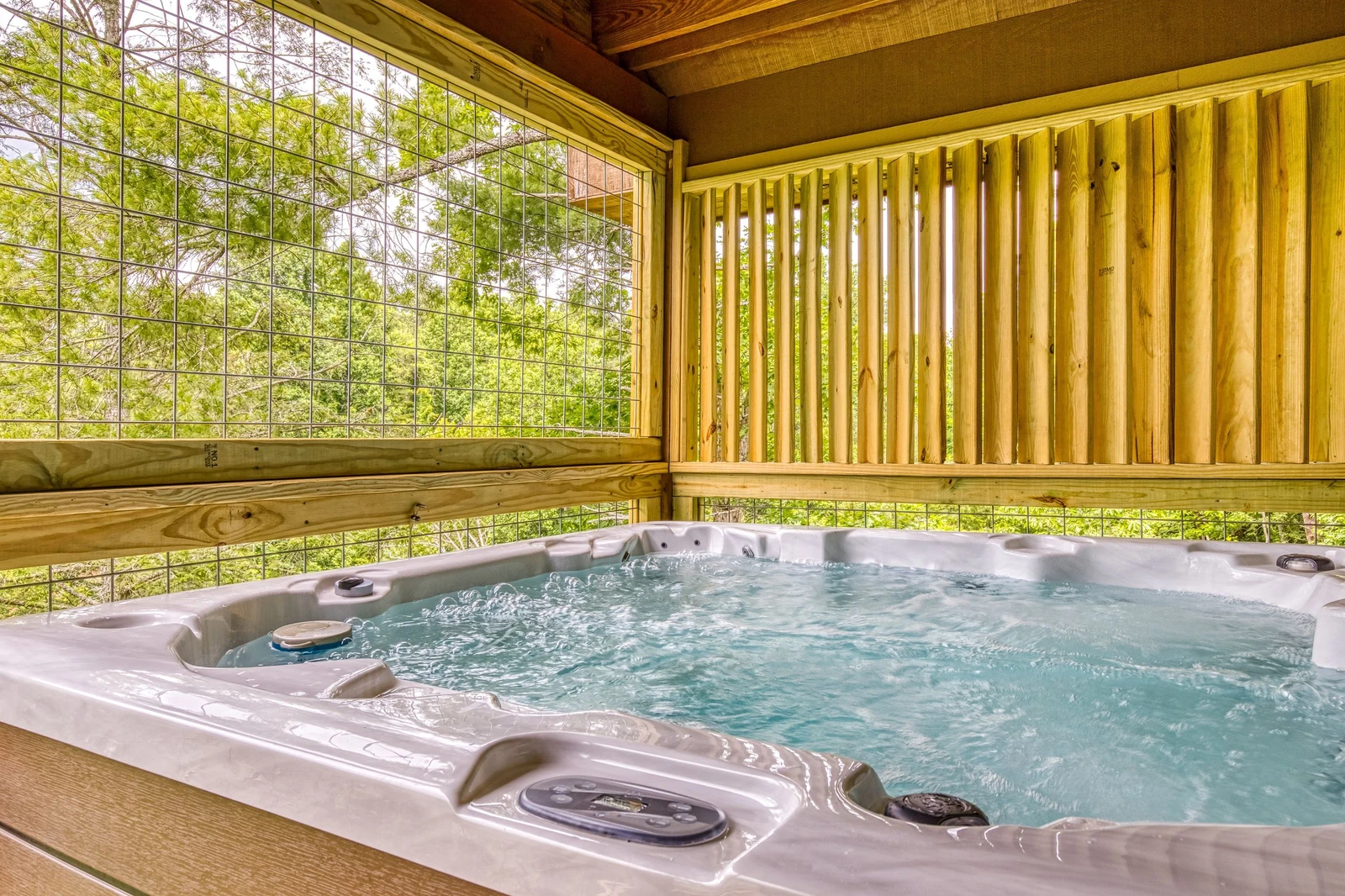 Bearadise Mountain Lodge hot tub on main level covered deck