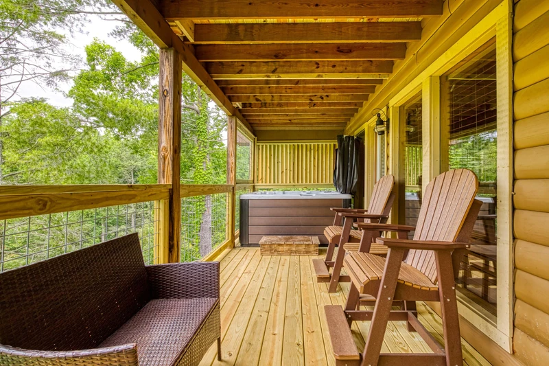 Bearadise Mountain Lodge main level covered back deck with hot tub