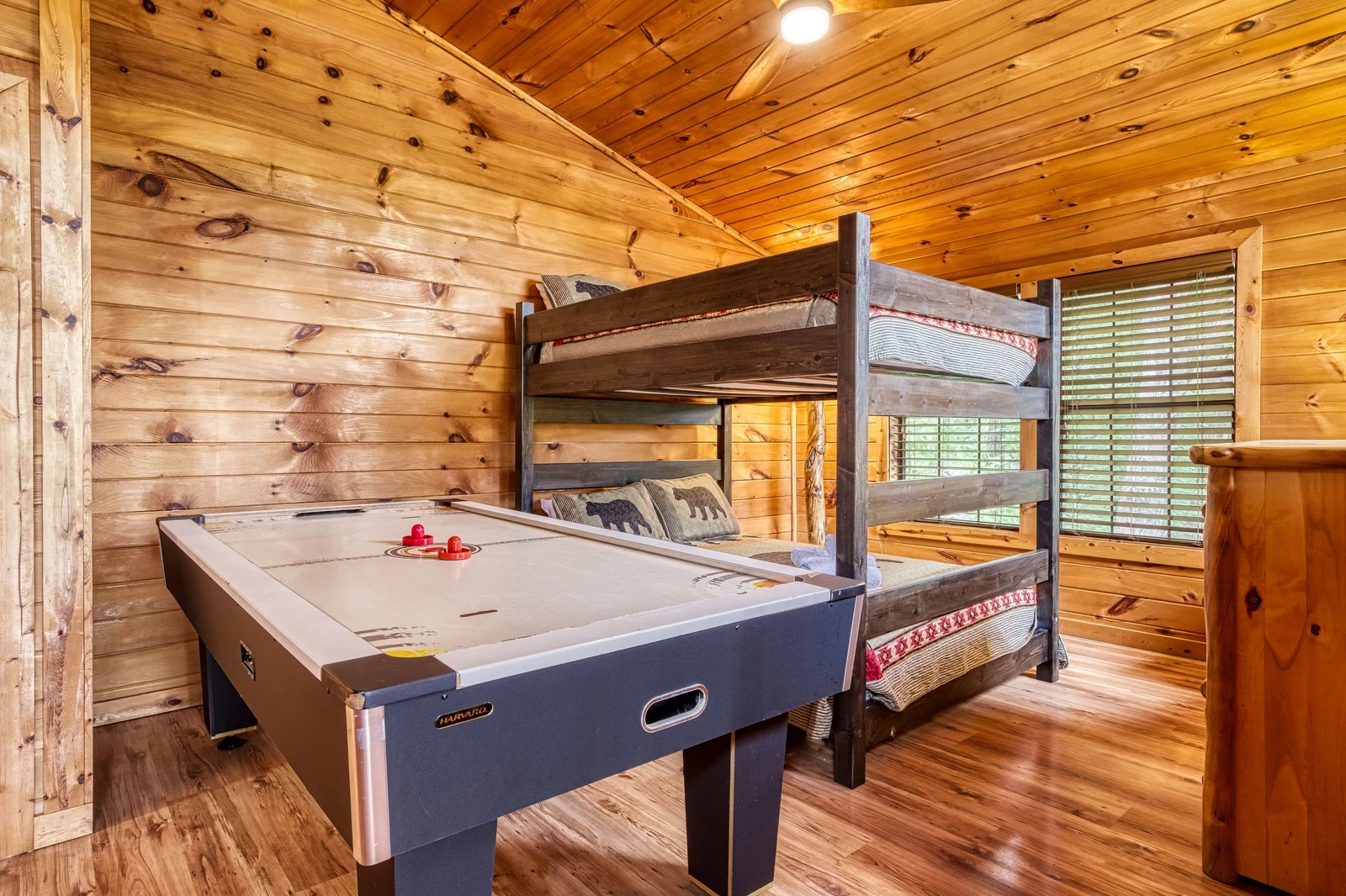 Bearadise Mountain Lodge upper level bedroom with air hockey table and bunk beds