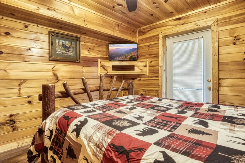 Bearadise Mountain Lodge lower level bedroom with 32 inch TV
