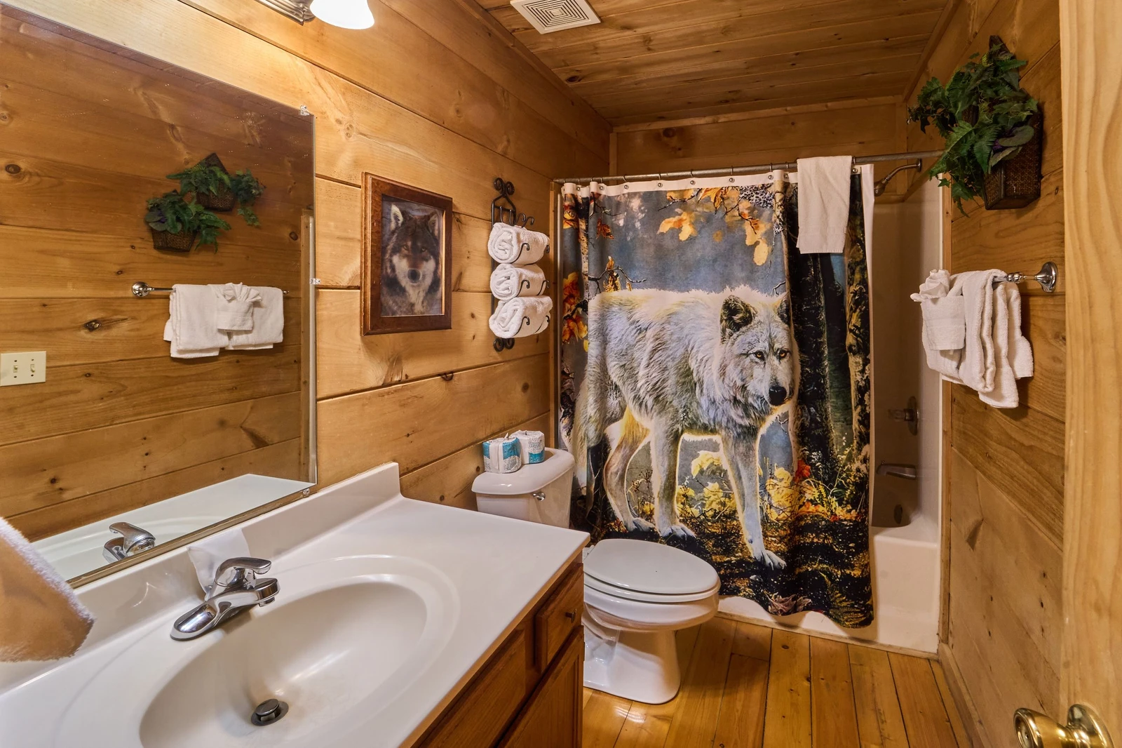 The bathroom has a tub/shower along with a hairdryer and a courtesy supply of bar soap, toilet paper, bath towels, hand towels, and wash cloths. ,