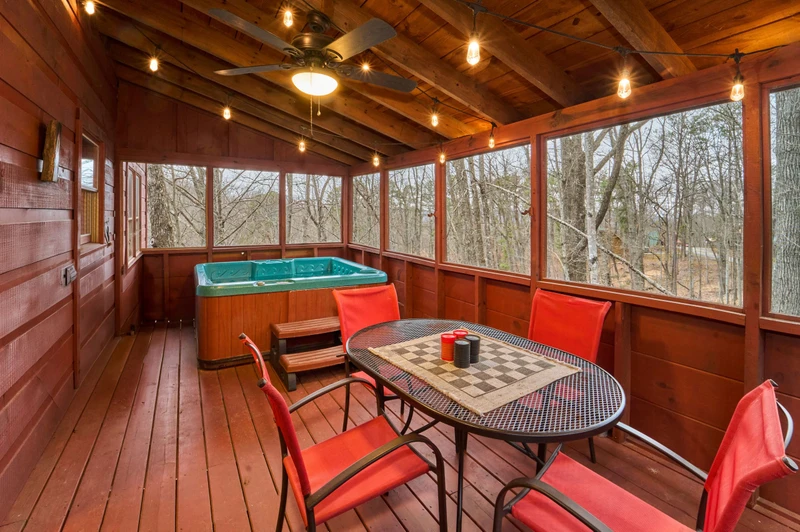 Enjoy the hot tub on the screened porch after a day of fun in the Smokies!