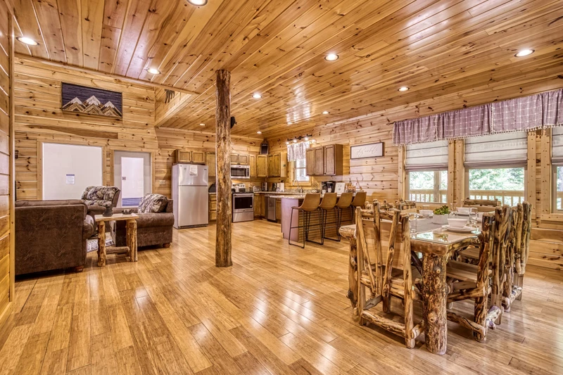 Woodness Gracious dining area, fully furnished kitchen, and living room