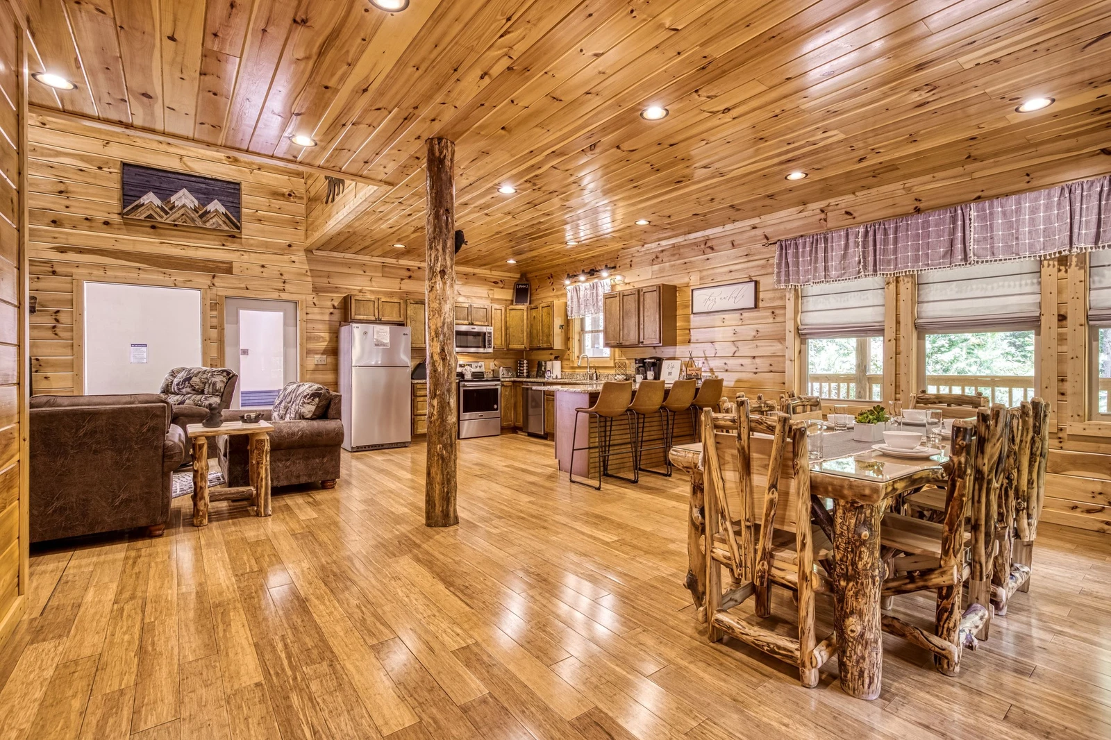 Woodness Gracious dining area, fully furnished kitchen, and living room