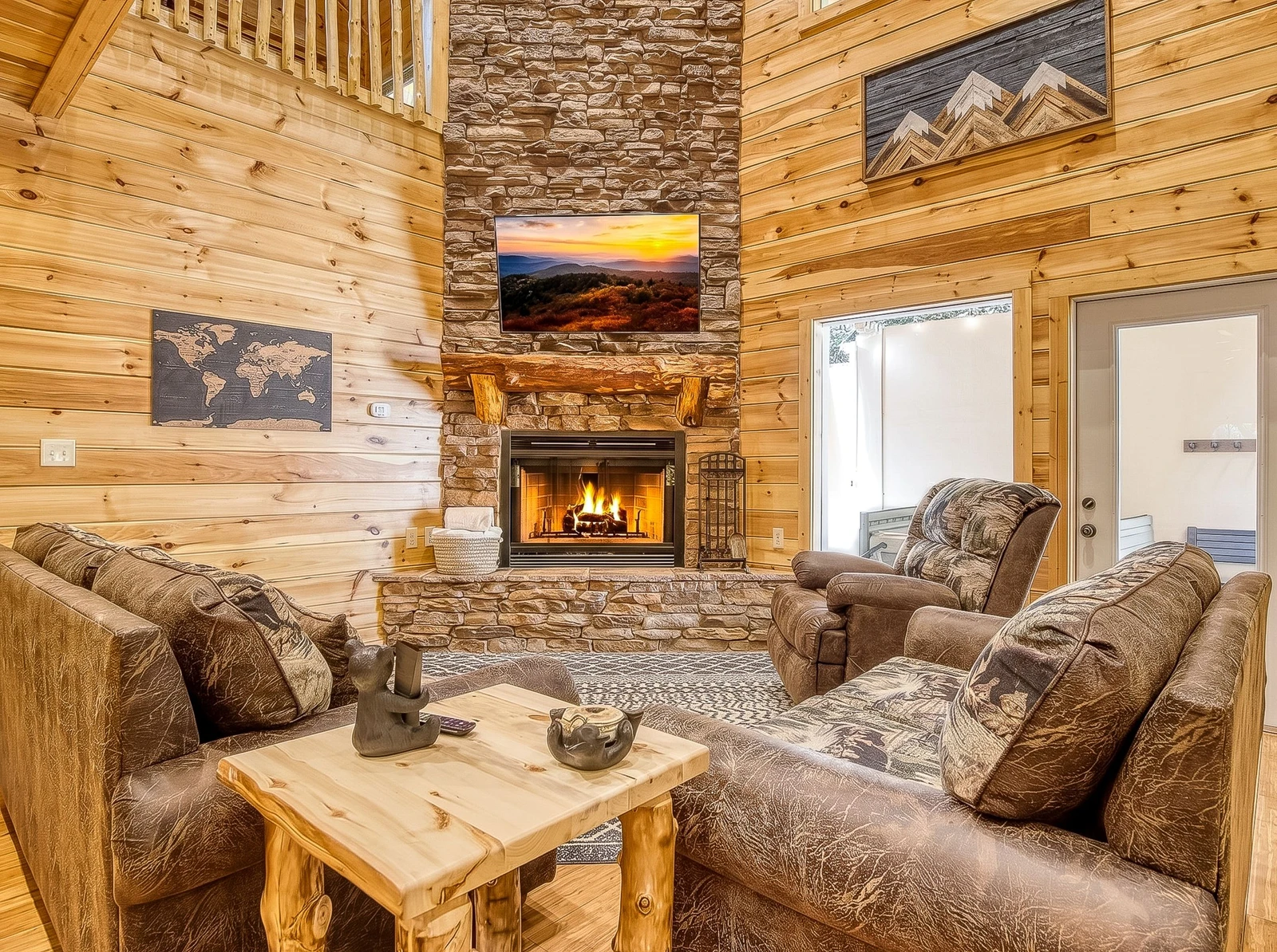 Woodness Gracious living room with seasonal stone encased wood burning fireplace