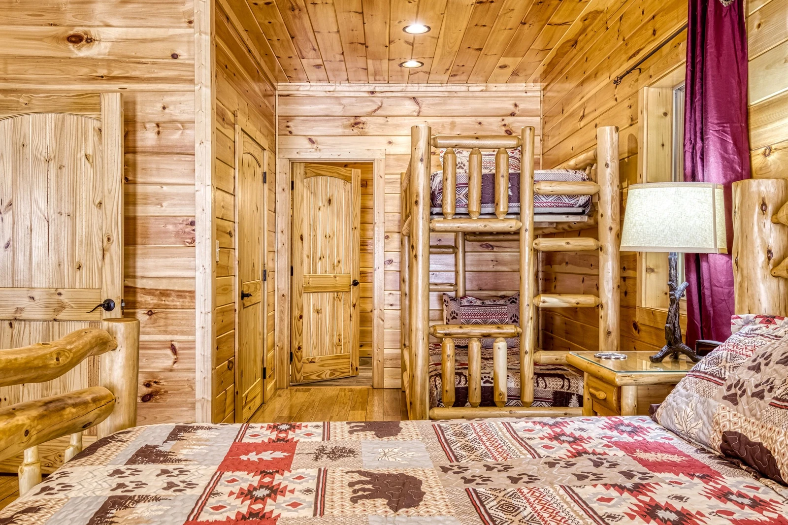 Woodness Gracious king size bed and bunk beds in main level bedroom