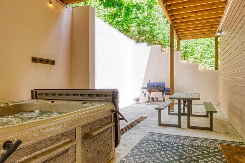 Woodness Gracious hot tub, picnic table, and charcoal grill