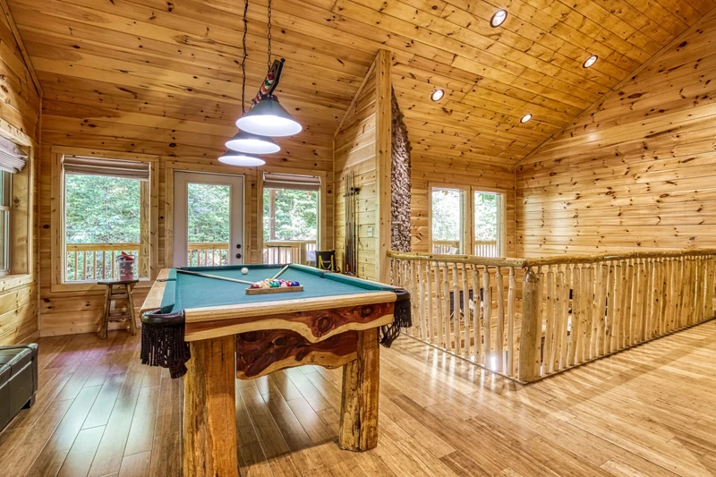 Woodness Gracious upper level game area with pool table