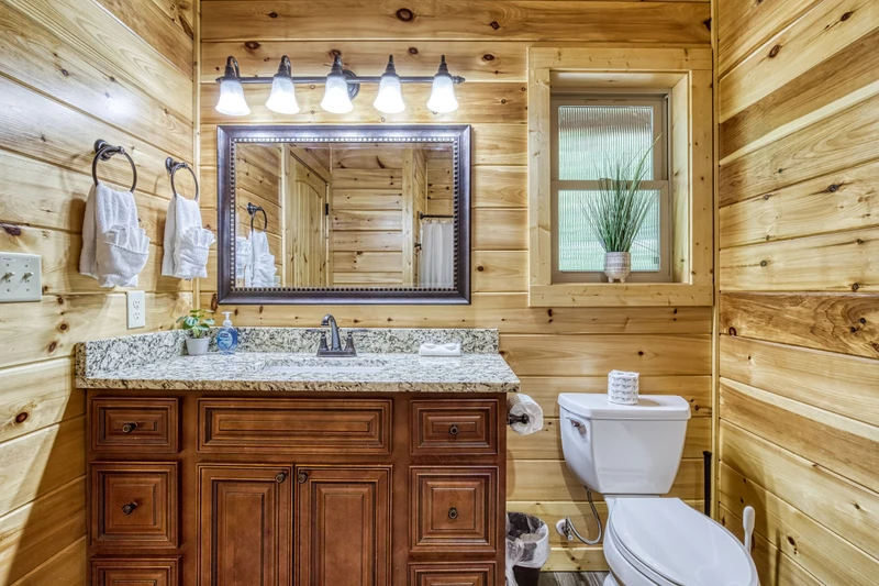 Woodness Gracious upper level bathroom with single vanity 