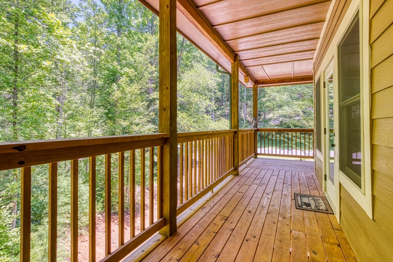 Woodness Gracious upper level covered wrap around deck
