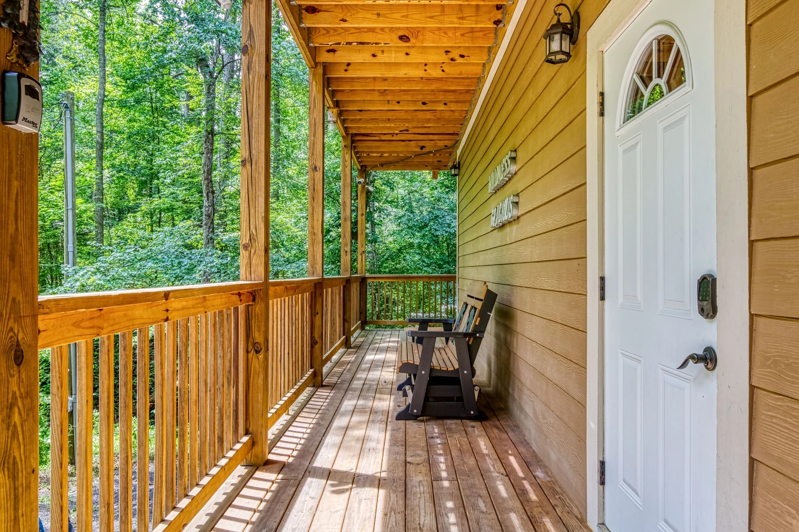 Woodness Gracious upper level covered wrap around deck