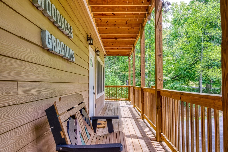 Woodness Gracious wrap around covered deck on the main level