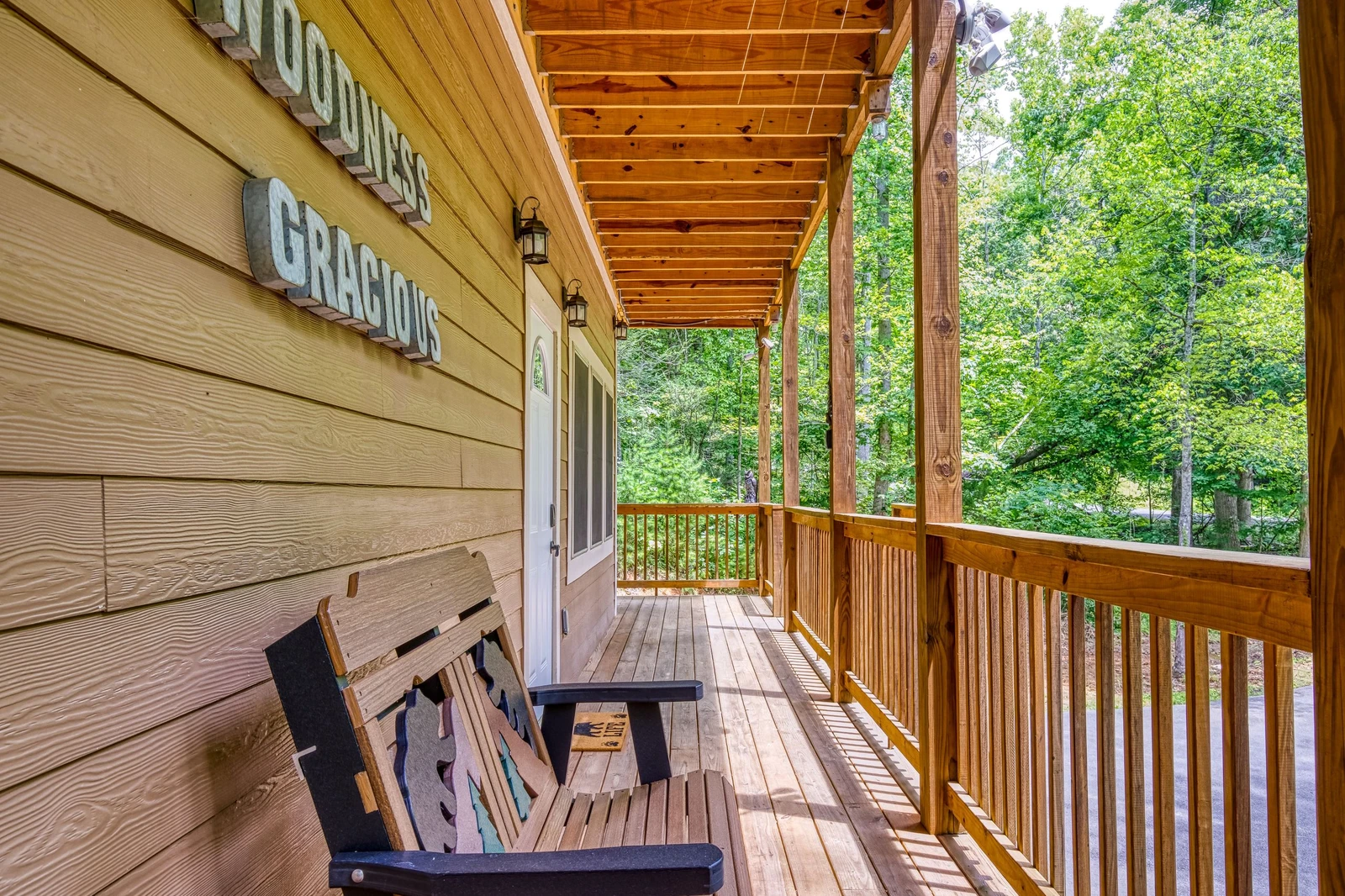 Woodness Gracious wrap around covered deck on the main level