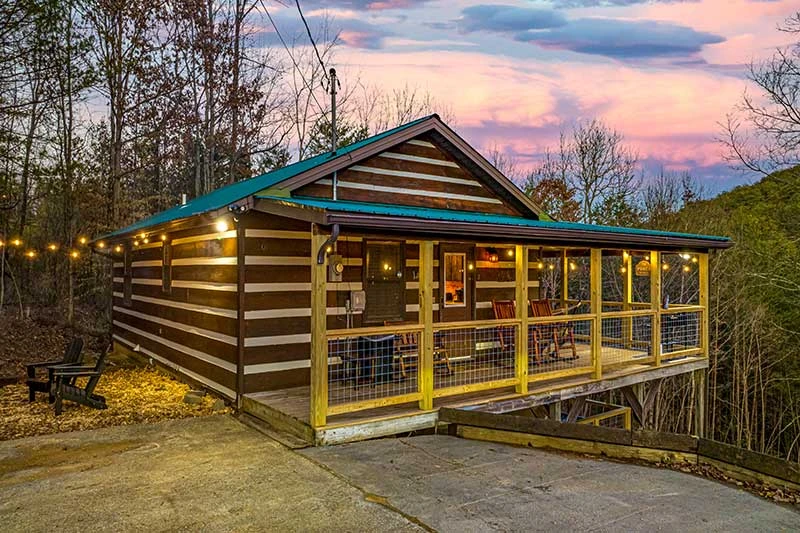 Cabin lights begin to glow in the Smokies sunset.