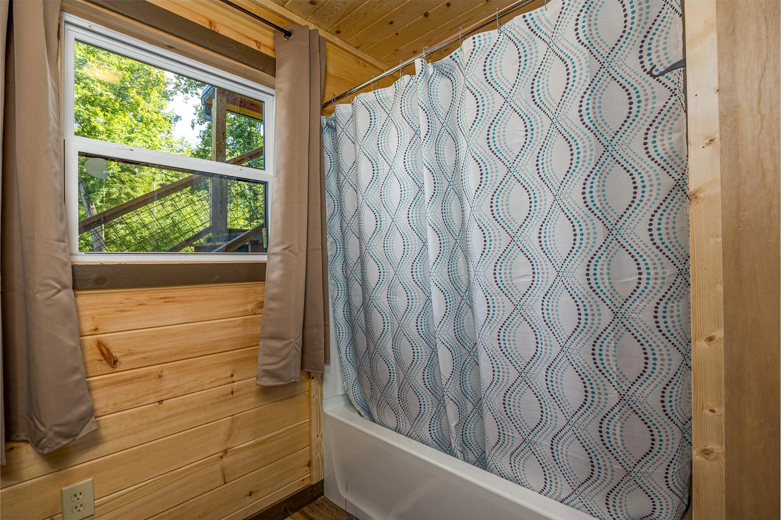 Your rental cabin's third bath shower.