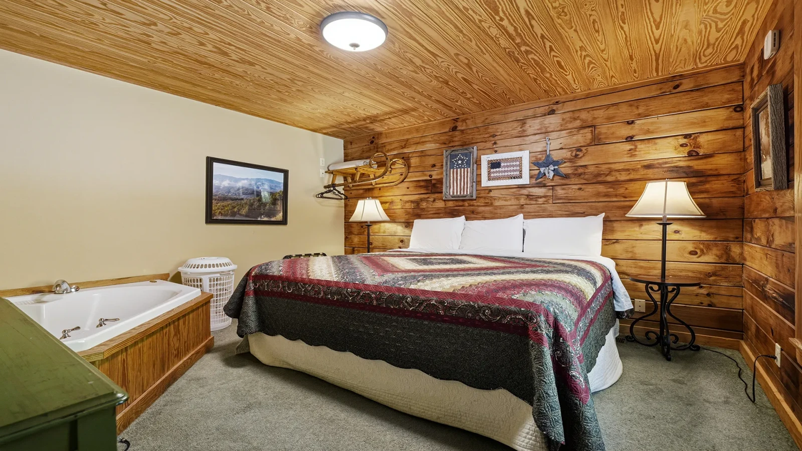 Cabin bedroom with Jacuzzi tub.