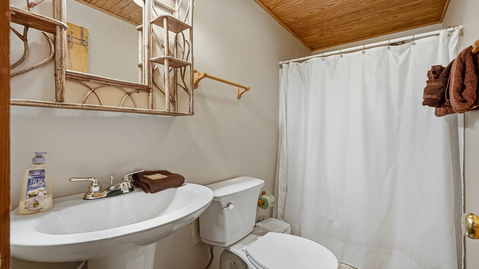 Full bath in cabin rental's first bedroom.