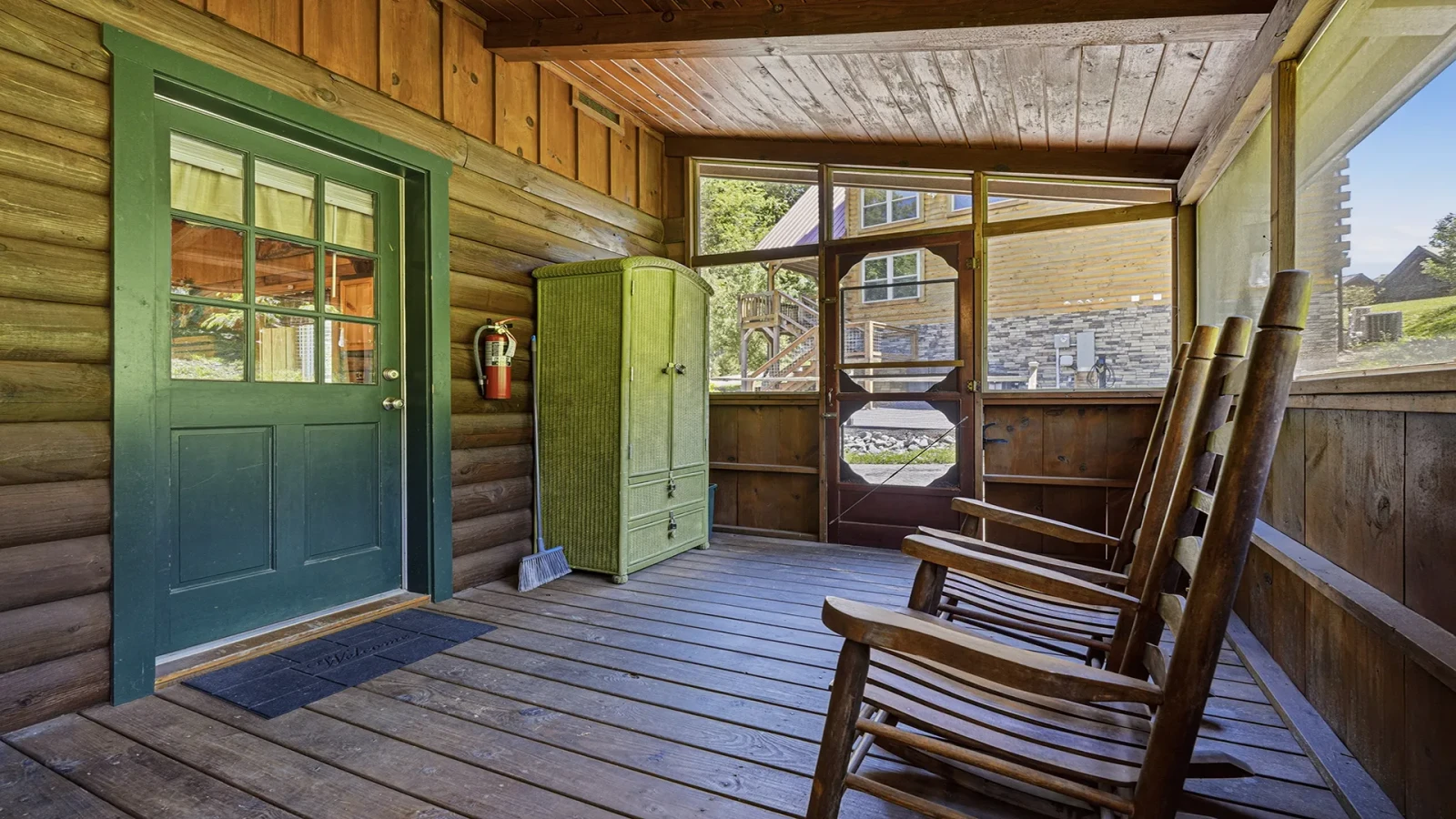Back  enclosed cabin porch, relax and feel the breeze.