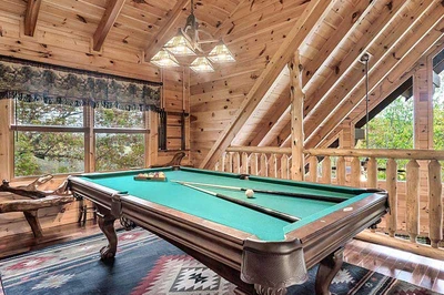 Family members can enjoy hours of fun on the cabin's pool table. 