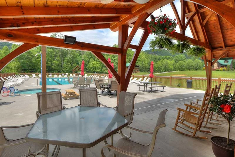 Poolside seating at Wears Valley Honey Suckle Meadows RV Park.
