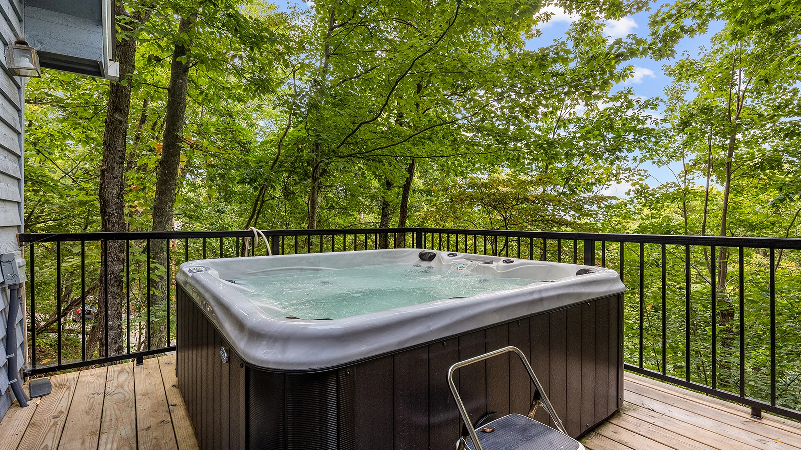 Your chalet's hot tub in Chaqlet Village where you can also enjoy three pools, tennis courts, arcades and more!