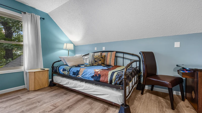 While not listed as a bedroom, the game room area offers more sleeping space with a daybed. 