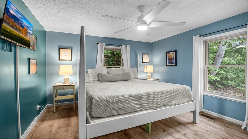 Your Gatlinburg chalet's second bedroom has a big window overlooking Smoky Mountains nature.