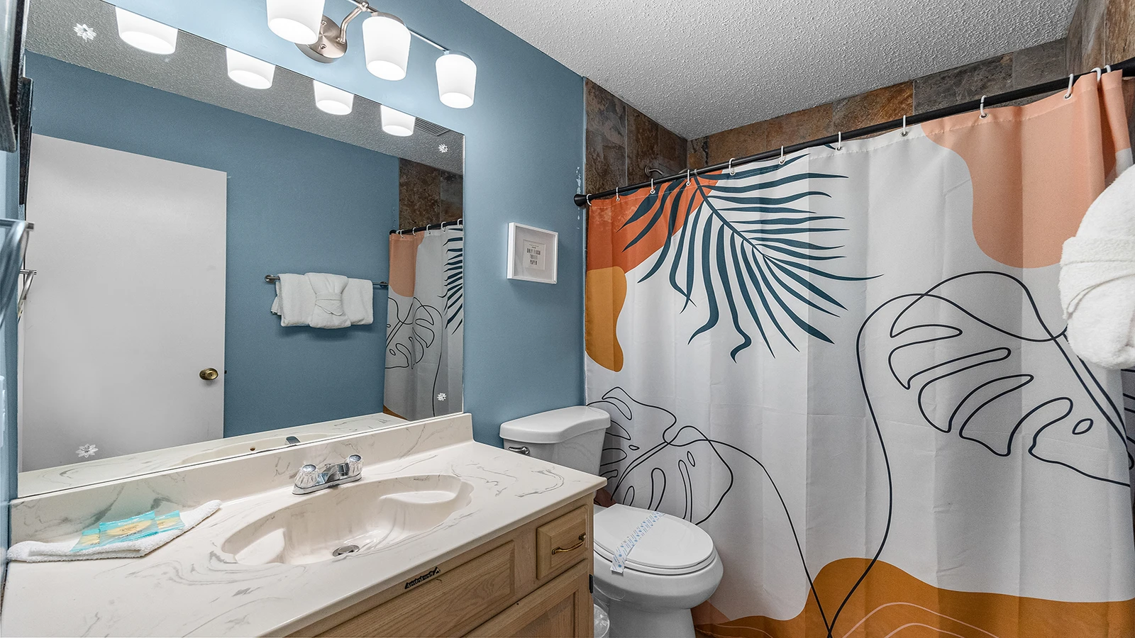 Full second bath with tub and shower combo.