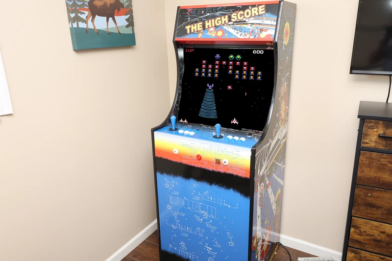 This awesome Smoky Mountains vacation home features and arcade machine with over 500 various games.