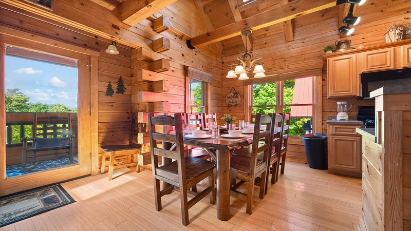 Enjoy family meals in your cabin's relaxed didning room with panoramic windows.