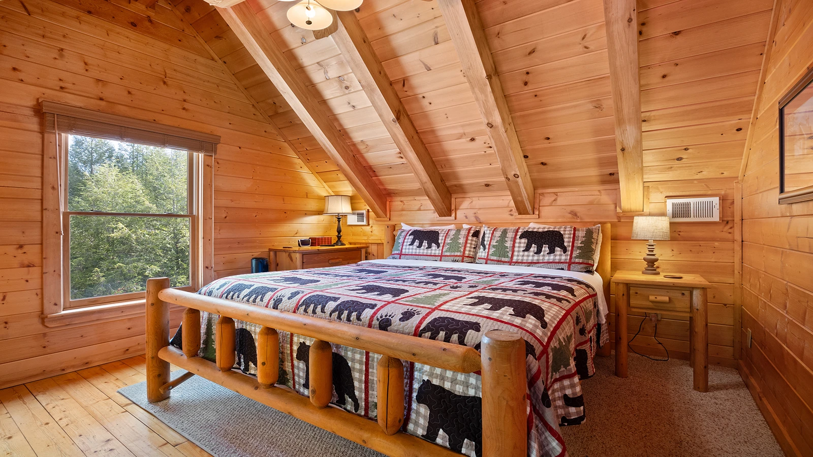 Fourth upstairs bedroom with king sized log bed.