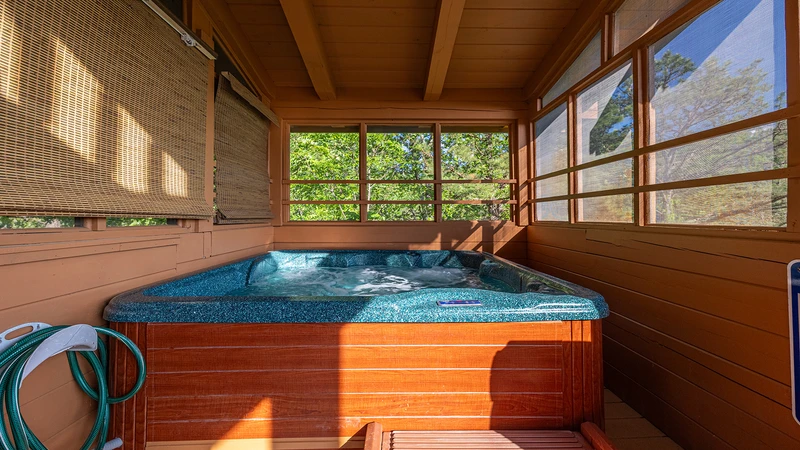 Screened in family sized hot tub. 