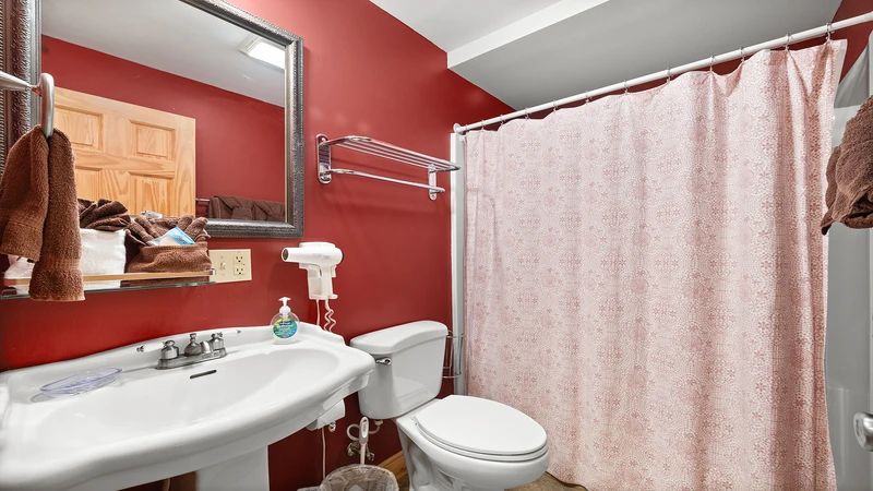 Tub shower combo in your cabin's second og three full baths.