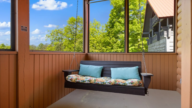 Nice days relax on your cabin's porch swing.