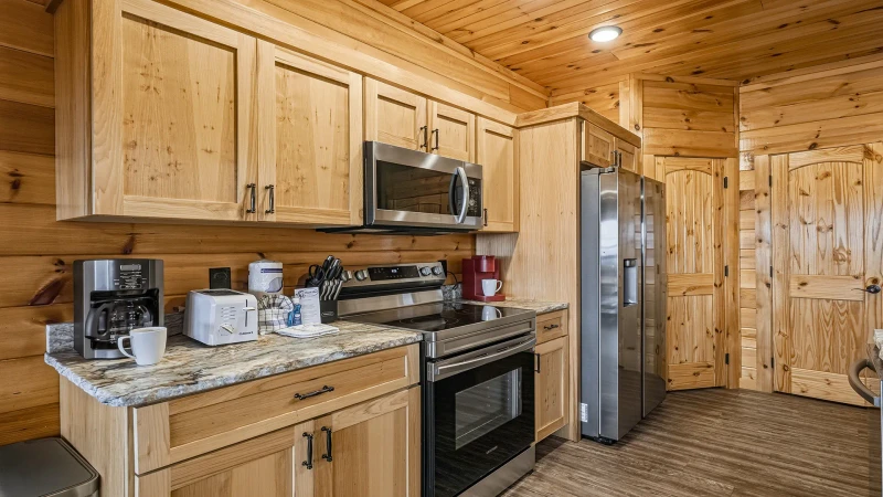 Stainless steel double fridge and large stove. 