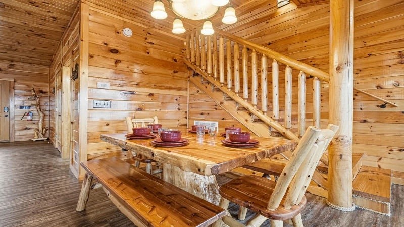 Log cabin stairs leading to the upstairs.