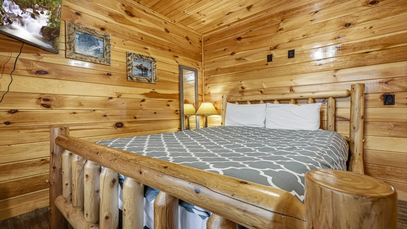 After a full and fun day in the Smokies find relaxation on this king sized log bed.