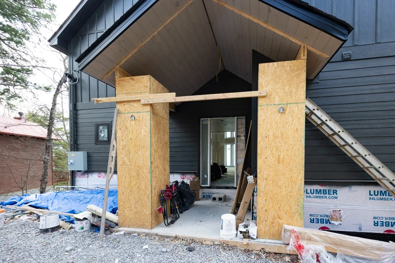 Workers hard at building the entry to a beautiful 3 bedroom cabin for your enjoyment.
