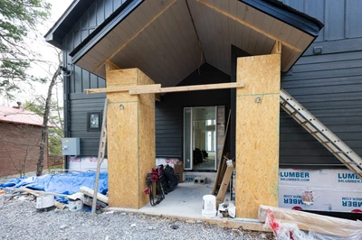 Workers hard at building the entry to a beautiful 3 bedroom cabin for your enjoyment.