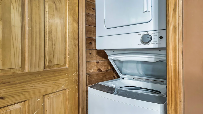 Stackable washer - dryer helps reduce needed travel space.