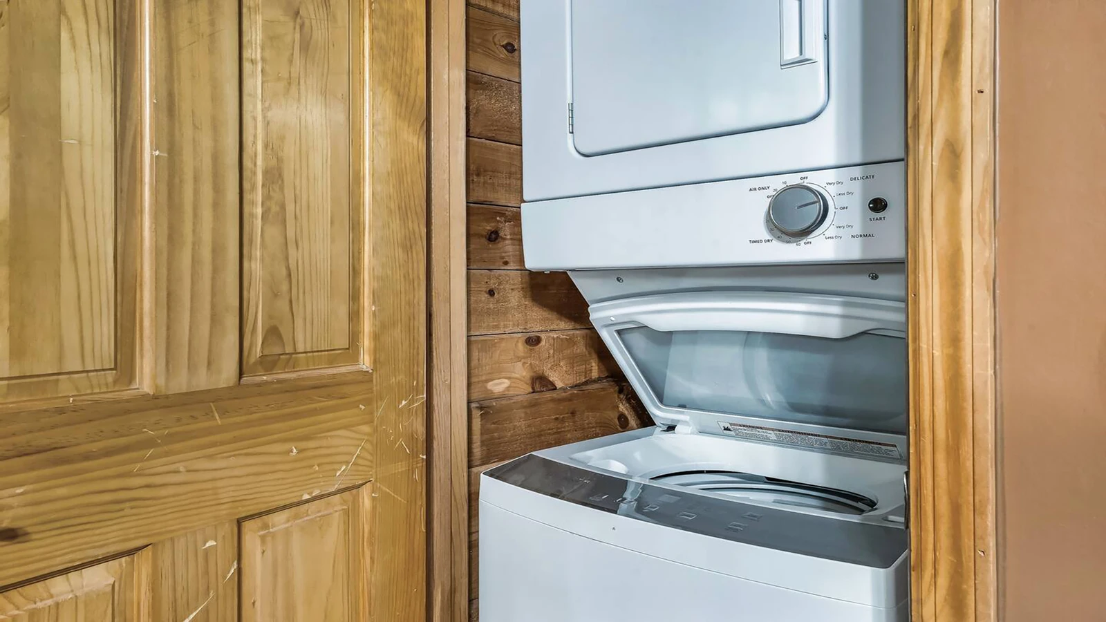 Stackable washer - dryer helps reduce needed travel space.