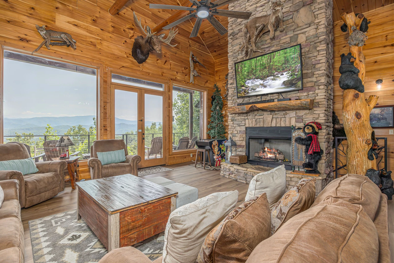 Enjoy the warmth of the double sided stacked stone fireplace.