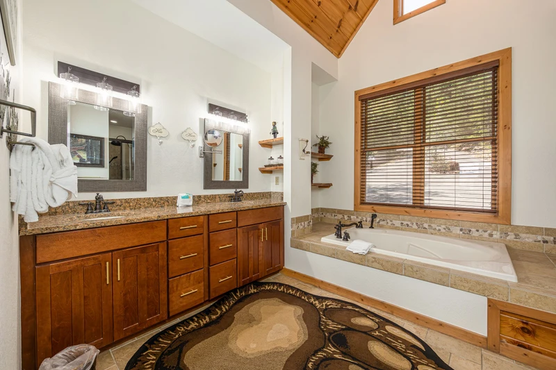 Nice bath with double sinks and Jacuzzi bath.
