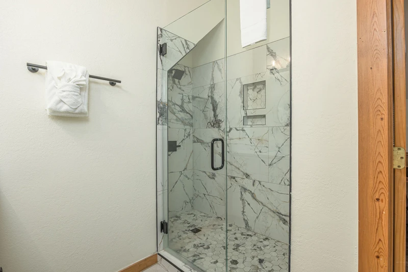 Step into this marvelous marbled glass shower.