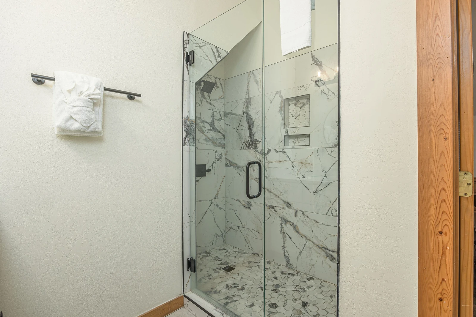 Step into this marvelous marbled glass shower.