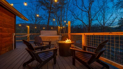 Inviting gas fire pit on the deck of your Smokies cabin.