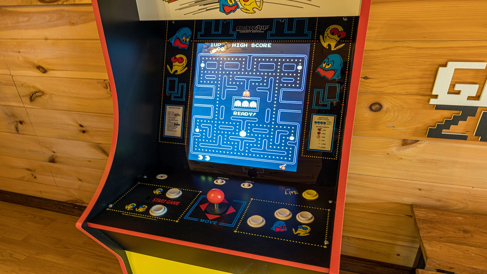 Cabin gameroom with Pac-Man arcade.