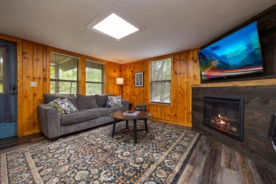Gas log fireplace in your cabin's living room.